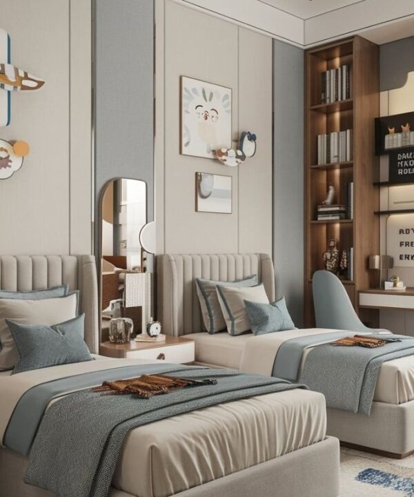 Modern shared bedroom with two single beds featuring upholstered beige headboards, blue and white bedding, central nightstand with décor, wall art with vertical panels, built-in shelving unit, desk setup with chair, patterned rug, and cozy lighting